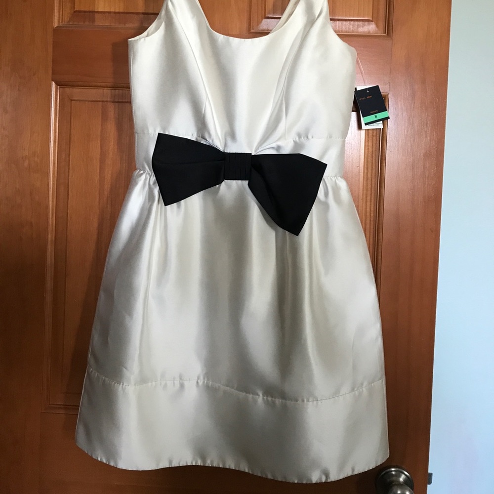 Beautiful white with black bow dress, brand new