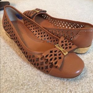 Brown leather flats with bow detail