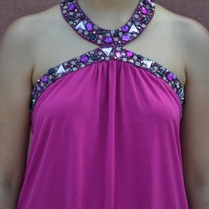 Decorated halter in magenta color.