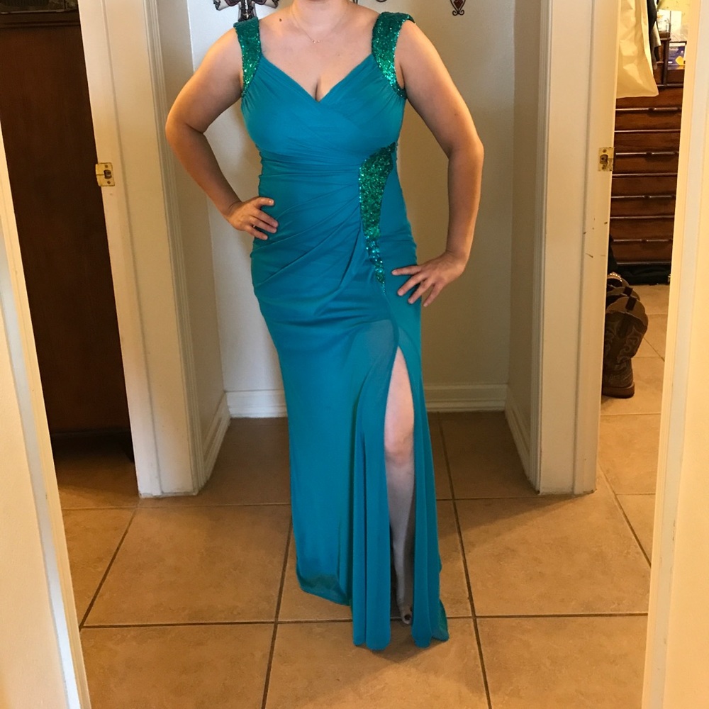 Long dress in teal with sequin detail .