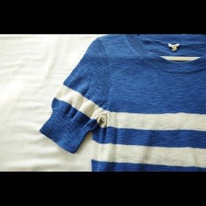 Blue and white striped knit top.