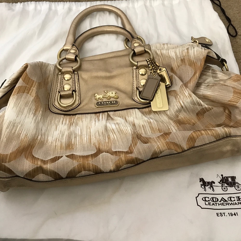 Gold and ivory coach purse