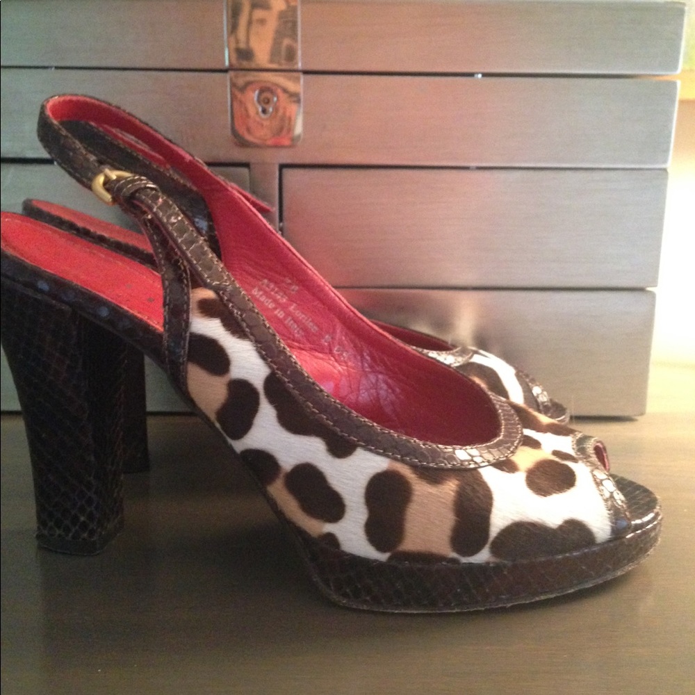 Coach pump sling backs.