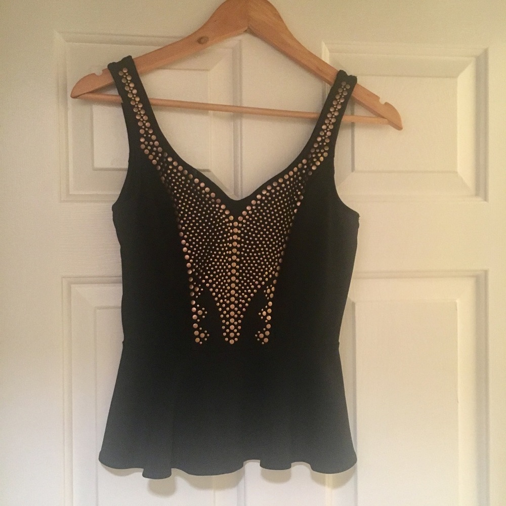 Bebe black sleeveless peplum top