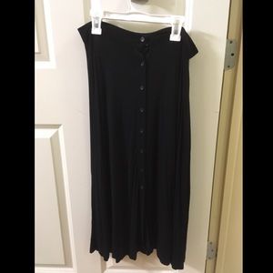 Black midi skirt with buttons and slits