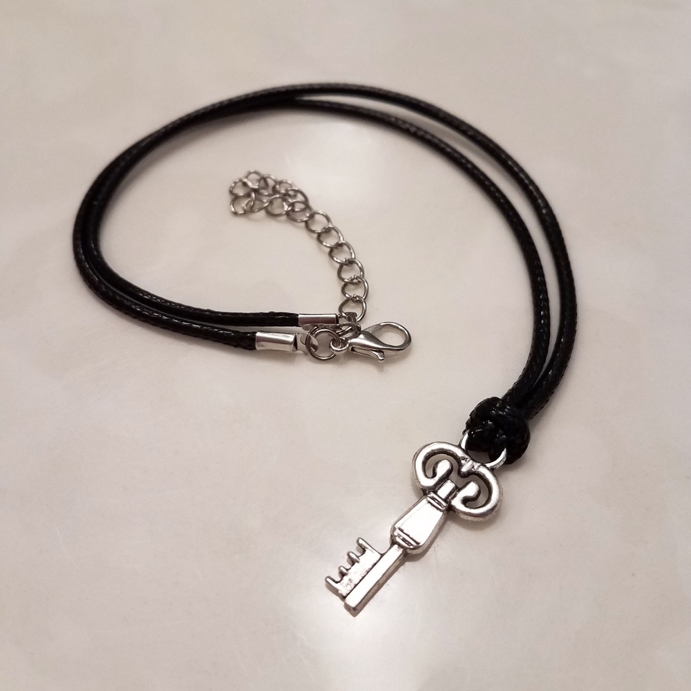 NWOT Key necklace on black cord