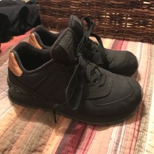 new balance sneakers - all black with gold heel
