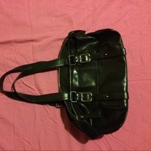 Black purse with buckles in the front