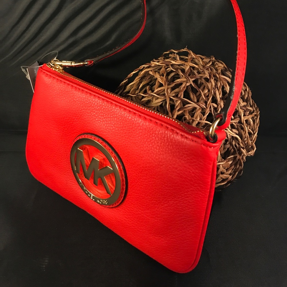 Ew Michael Kors bright burn orange purses!!!