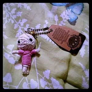 $4 or free with purchase. String doll keychain