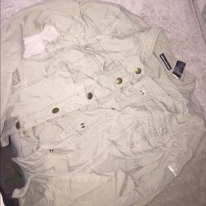 a olive green jacket with 4 pockets