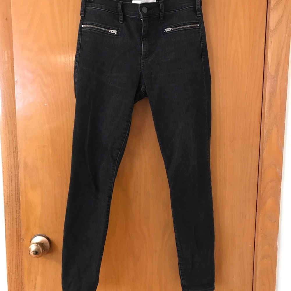 Black jeans with zippers for front pockets. Gap