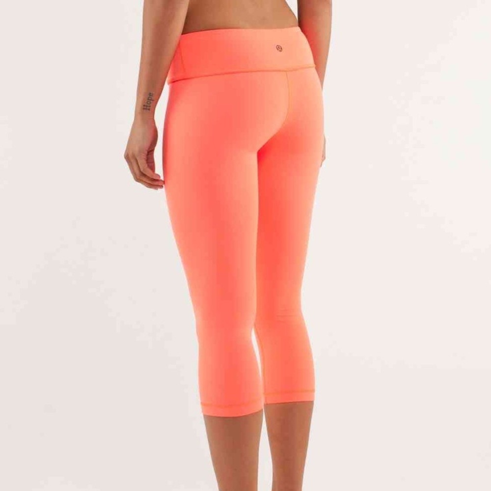 Bright pink Lululemon crop pants