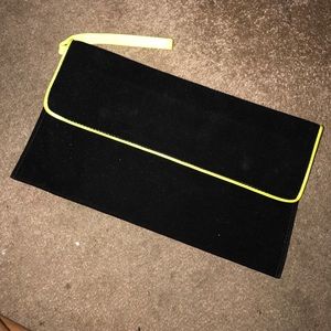Black faux suede and neon leather clutch Black faux suede and neon leather clutch