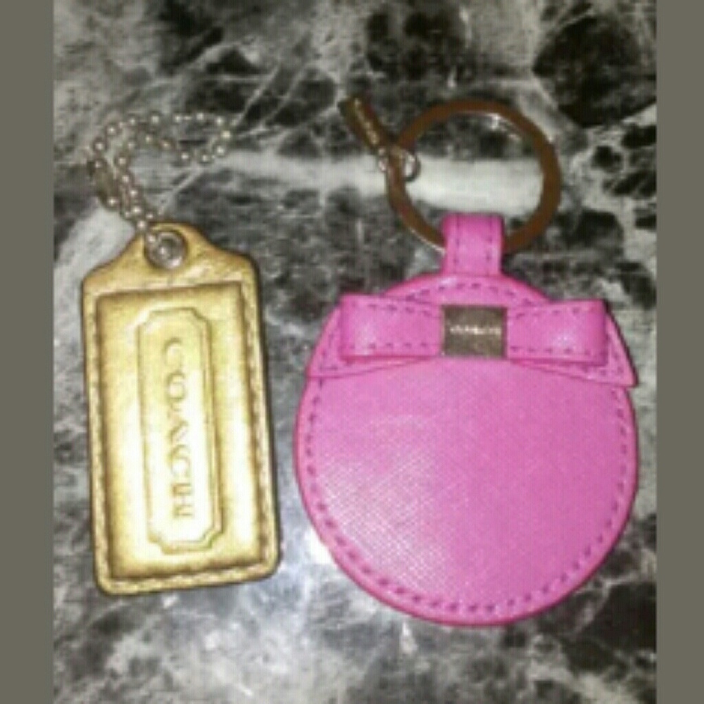 2 Coach key chain pink bronze never used