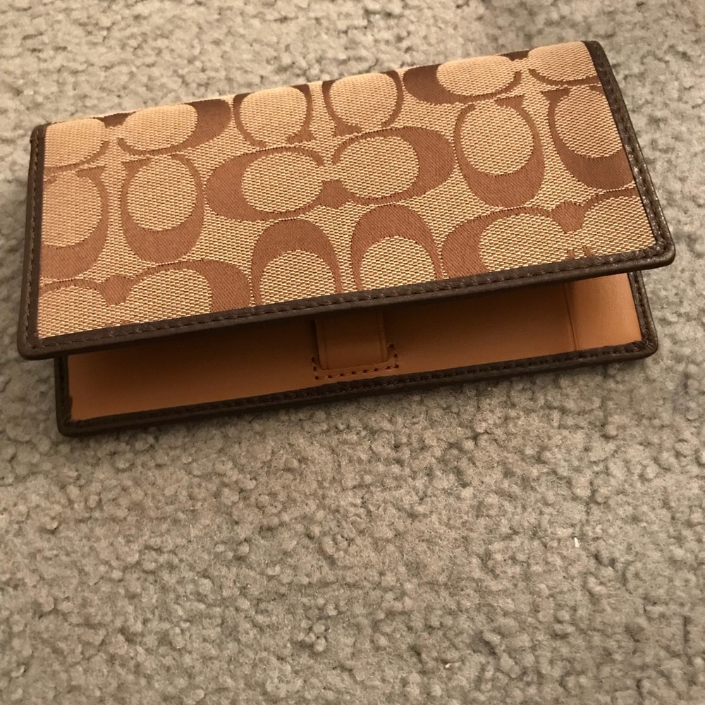 Coach checkbook holder.