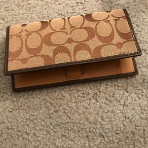 Coach checkbook holder.
