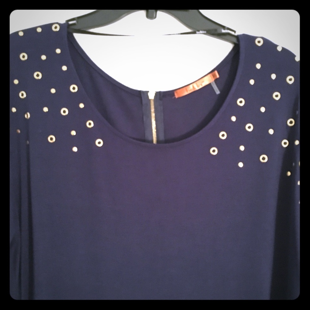 Navy top with metallic detail.