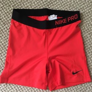 Red Nike Pro Spandex athletic shorts Medium