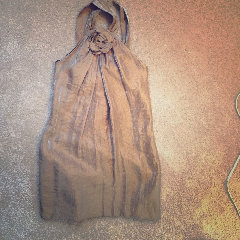 Bronze dress with flower in the front.