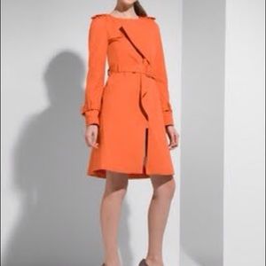 Orange ruffle front trench coat