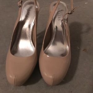 A nude pump with strap back.