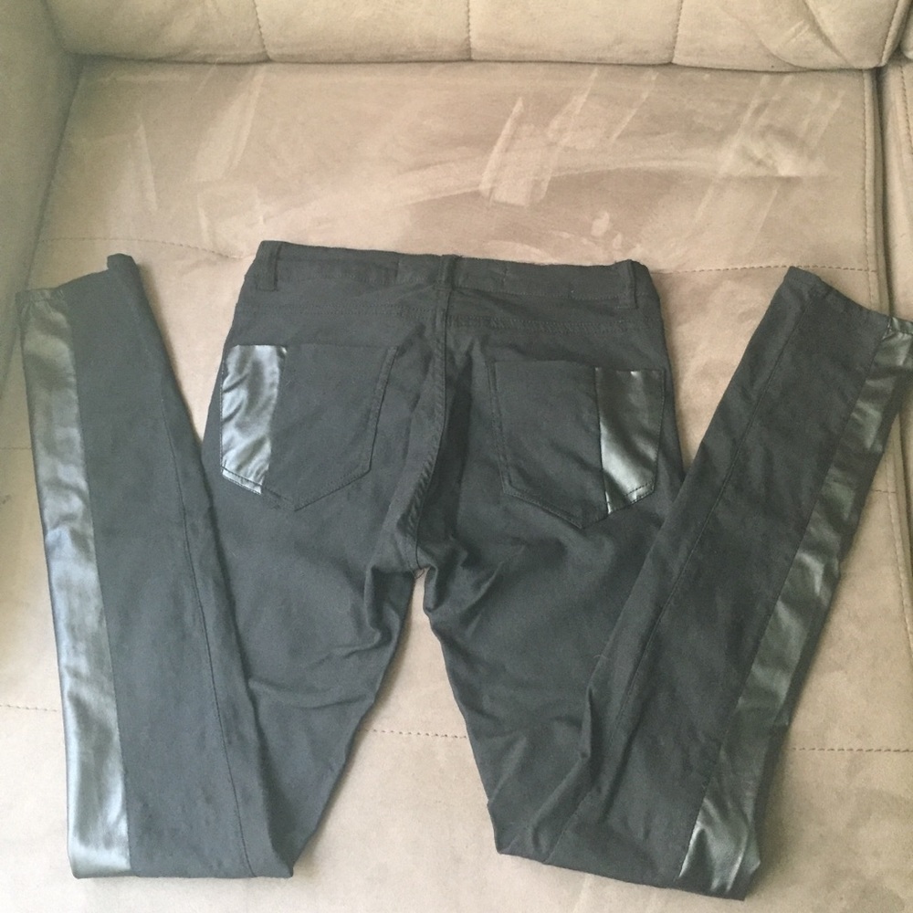 Black stretch  pants with leather stripes.