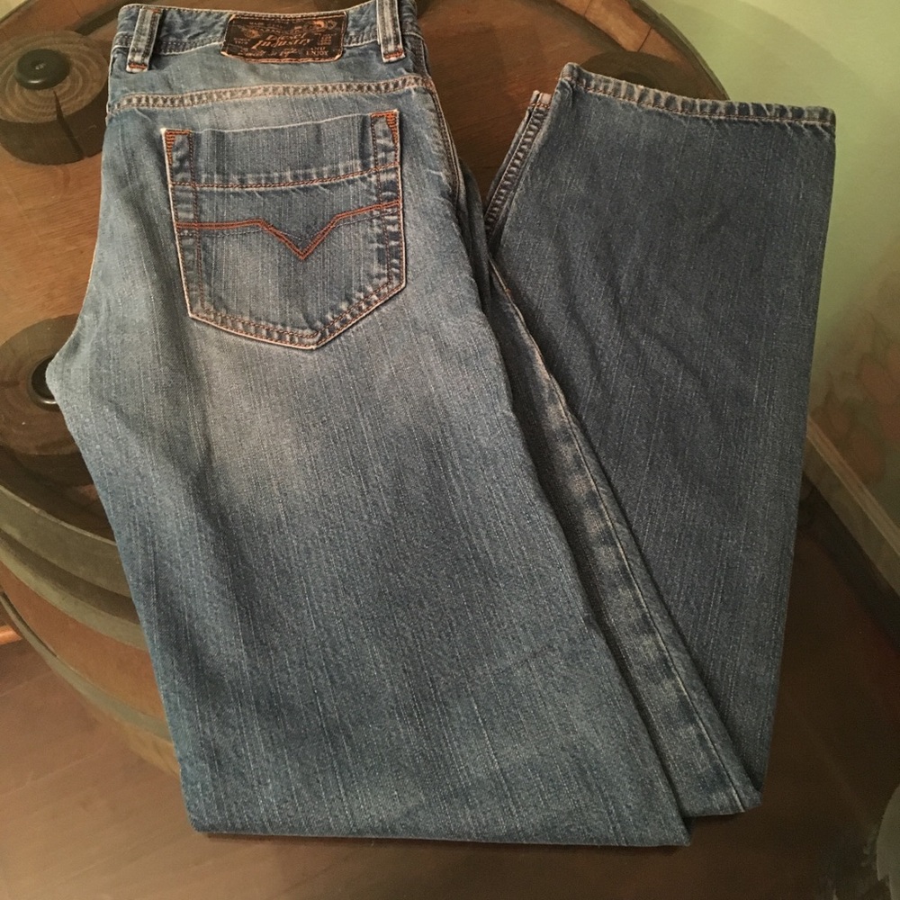 Men's Diesel straight leg dark wash jeans.