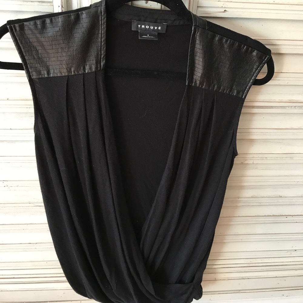 A black shirt with faux leather gathered bottom