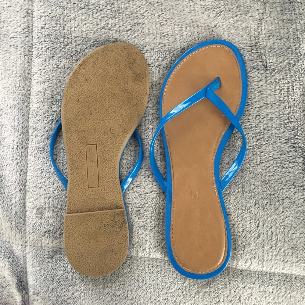 Blue trimmed flip flops