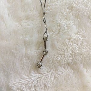 Diamond 3 stone necklace.