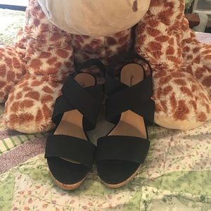 Sandals.  Black stretchy straps. Size 7