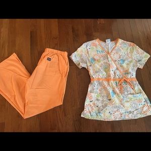 Orange scrub pants with printed scrub top.