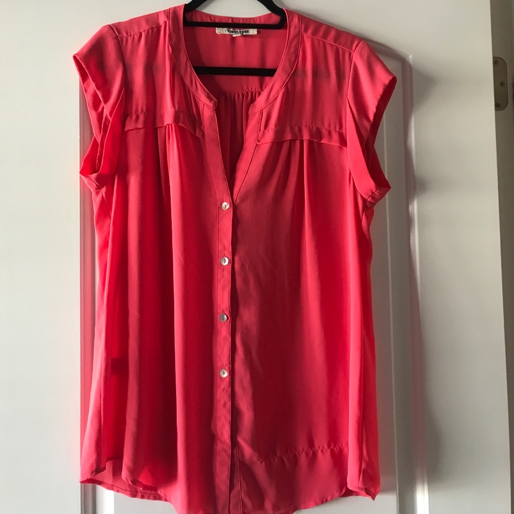 Pink, loose fit blouse.