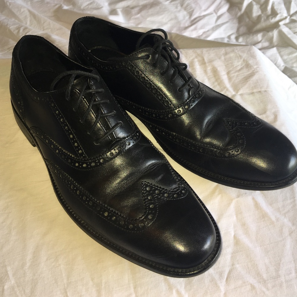 Black men's Cole Haan wingtip oxfords.