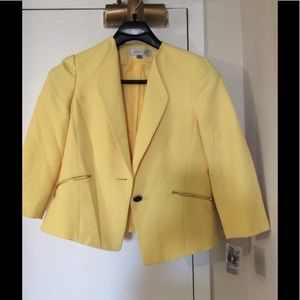 Yellow blazer, tags on