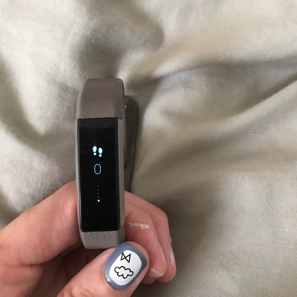 Fitbit Alta, charger, and 5 straps