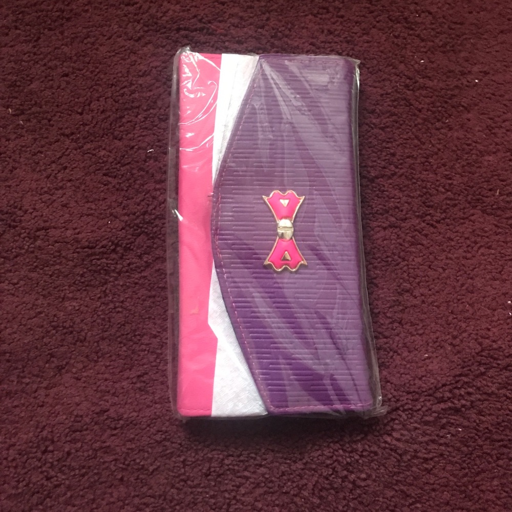 NWOT purple and pink bow clutch