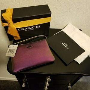 Coach Hologram wristlet.