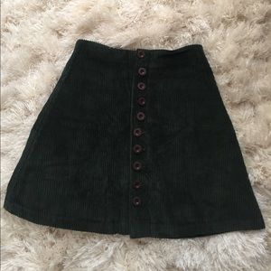 A green button up skirt