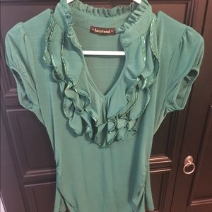 Cute emerald green top with ruffle detail