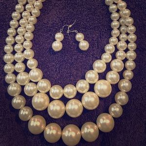 Three strand pearl necklace with earrings