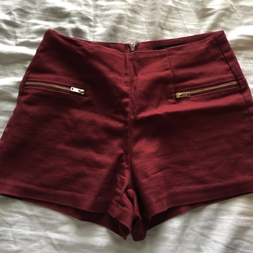 Maroon shorts with zip on the back