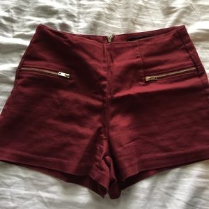 Maroon shorts with zip on the back