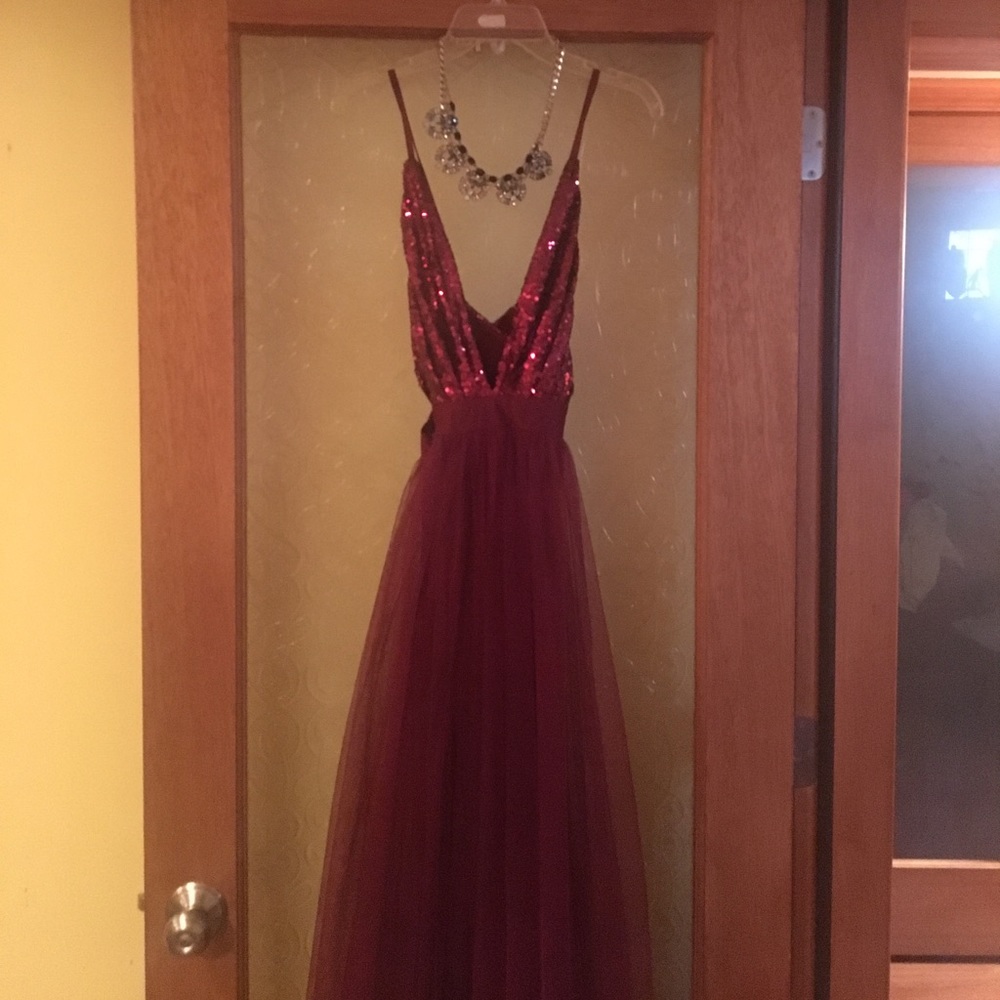A beautiful floor length burgundy gown.
