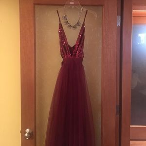 A beautiful floor length burgundy gown.
