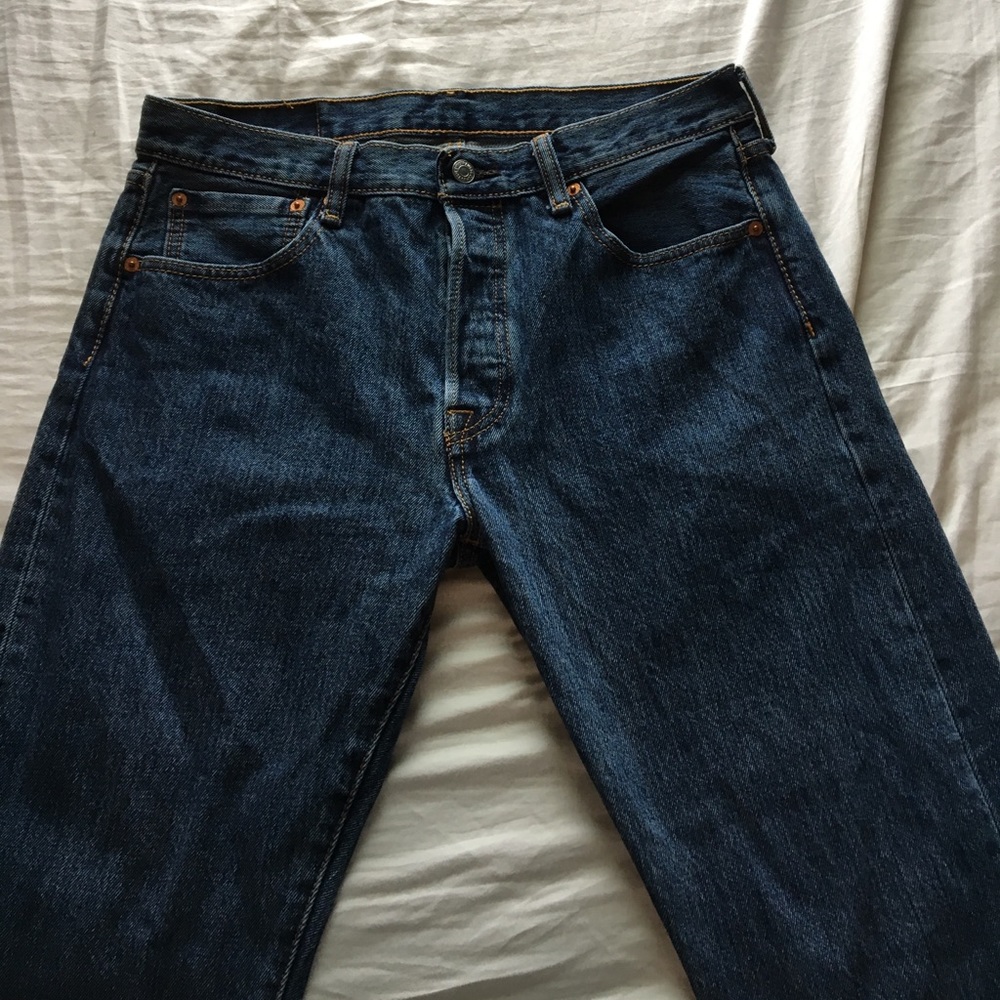 Levi jeans with the bottoms cut slightly