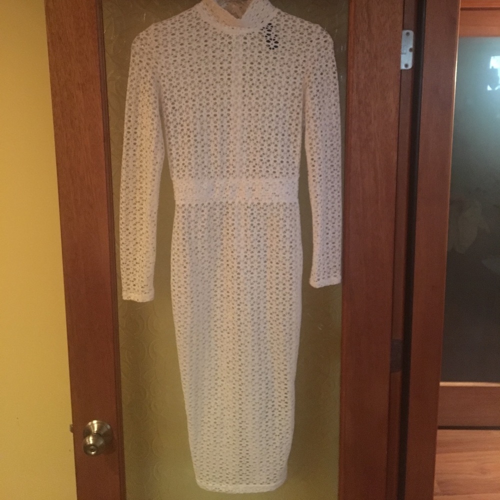 An all white knee length dress.