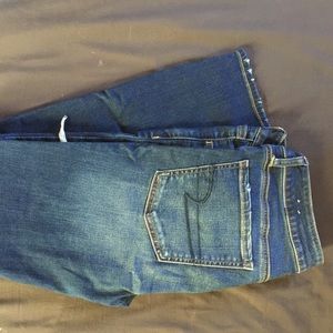 American Eagle ripped up blue jeggings.
