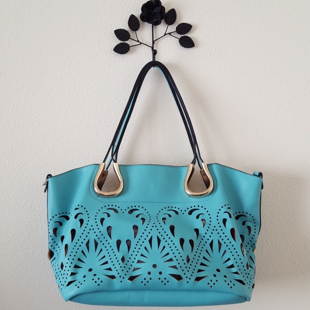 Large turquoise cutout hand bag